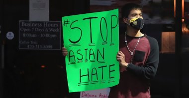 Jesus Estrella stands outside Young’s Asian Massage where four people were killed Tuesday, Atlanta, Georgia, U.S., March 17, 2021. (AP Photo)
