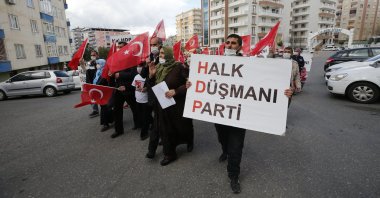 Kurdish mothers participate in a protest to demand the return of their children abducted by the PKK terrorist group and the closure of the pro-PKK Peoples' Democratic Party (HDP) in front of its Diyarbakır headquarters, southeastern Turkey, March 18, 2021. (AA Photo)