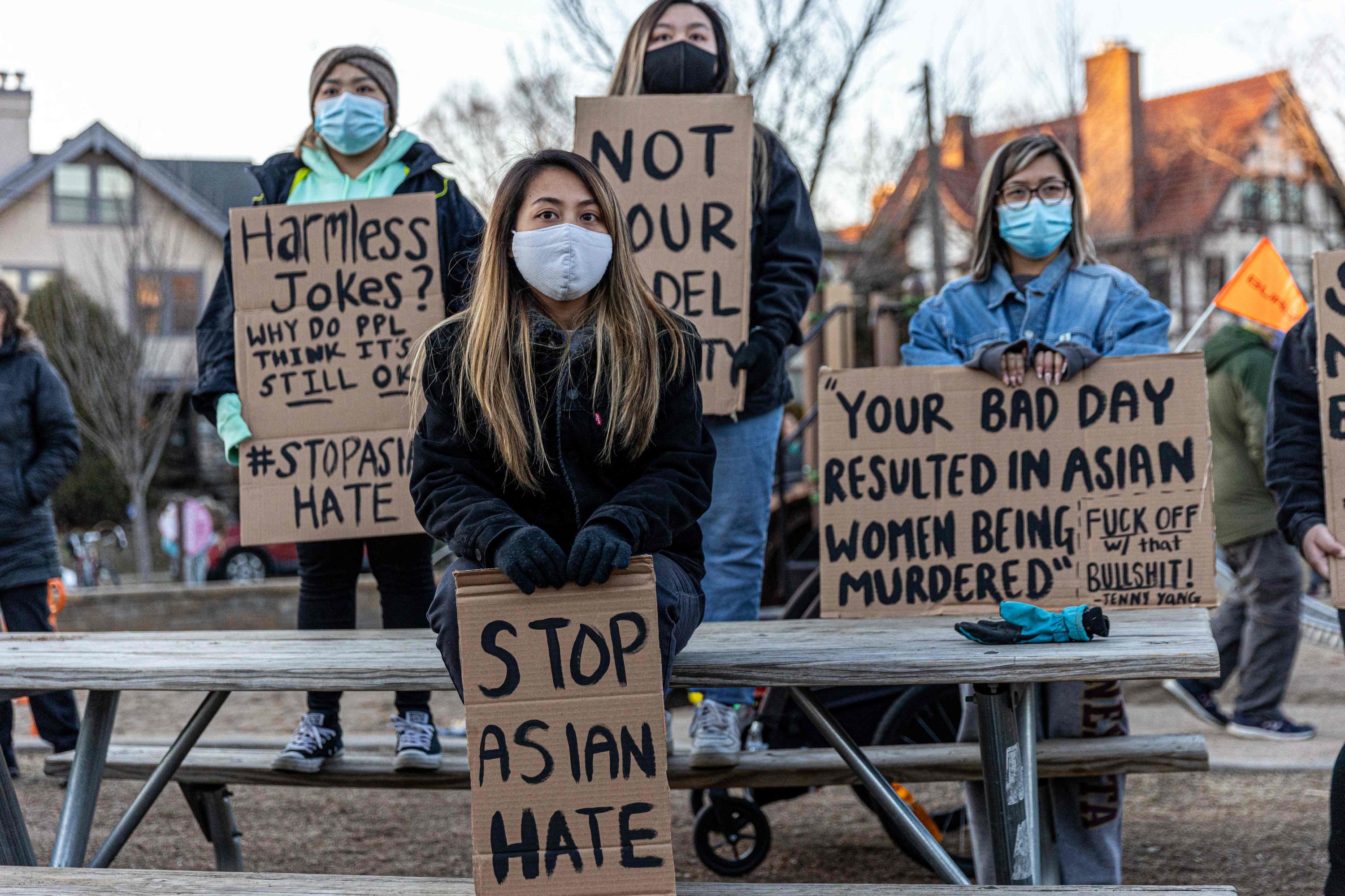 People hold signs during the Asian Solidarity March rally against anti-Asian hate in response to recent anti-Asian crime, Minneapolis, Minnesota, March 18, 2021. (AFP Photo)