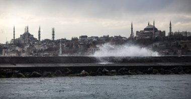 A sea wave hits a breakwater amid strong winds, with the Blue Mosque (L) and the Hagia Sophia Grand Mosque (R) seen in the background, at the Bosporus, Istanbul, Turkey, March 16, 2021. (Photo by Getty Images)
