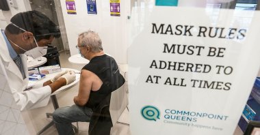 Pharmacist Ambar Keluskar inoculates a patient with the first dose of the Moderna COVID-19 vaccine at a pop-up site on March 18, 2021, in New York. (AP Photo)