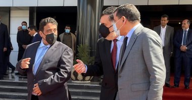 Libyan Prime Minister Abdul Hamid Dbeibah, Libya's internationally recognized former Prime Minister Fayez Sarraj and Mohammed Menfi, head of the Presidency Council, arrive ahead of the handover ceremony in Tripoli, Libya, March 16, 2021. (REUTERS Photo)