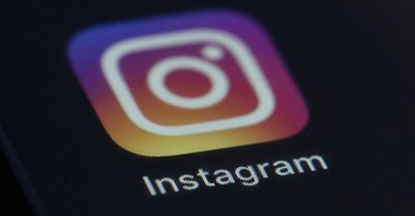 The Instagram app icon is displayed on the screen of a mobile device in New York, U.S., Aug. 23, 2019. (AP Photo)