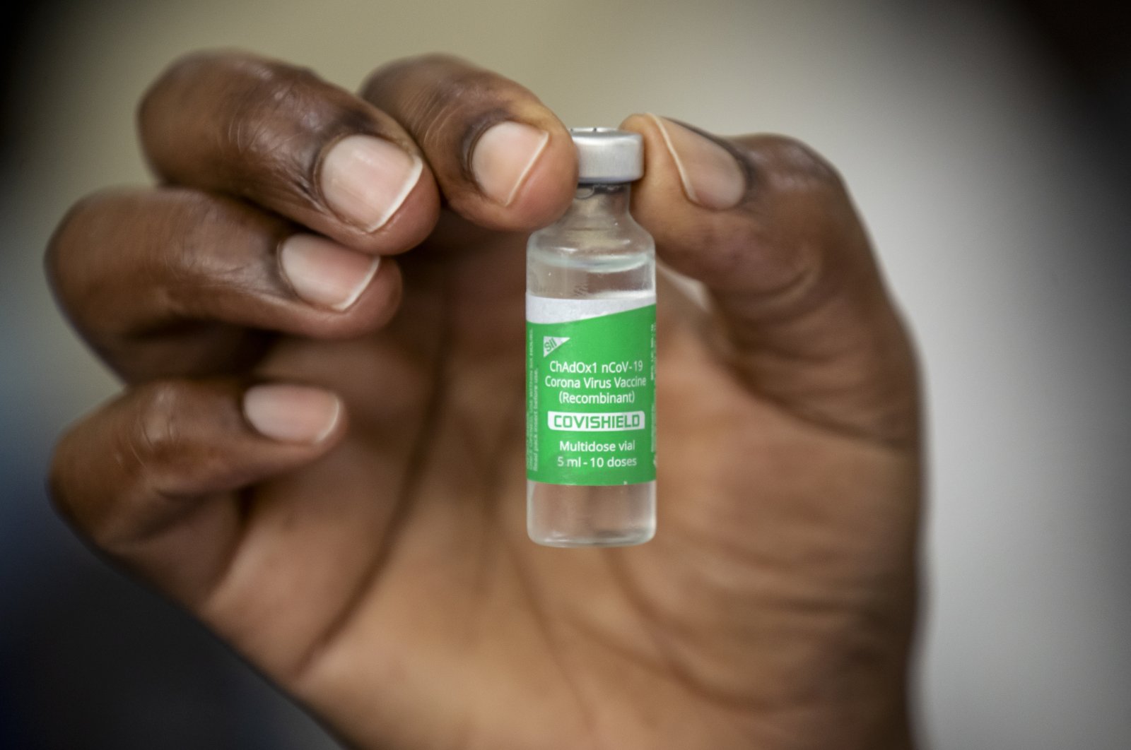 A nurse holds a vial of AstraZeneca COVID-19 vaccine provided through the global COVAX initiative, at Kenyatta National Hospital in Nairobi, Kenya, March 5, 2021. (AP Photo)