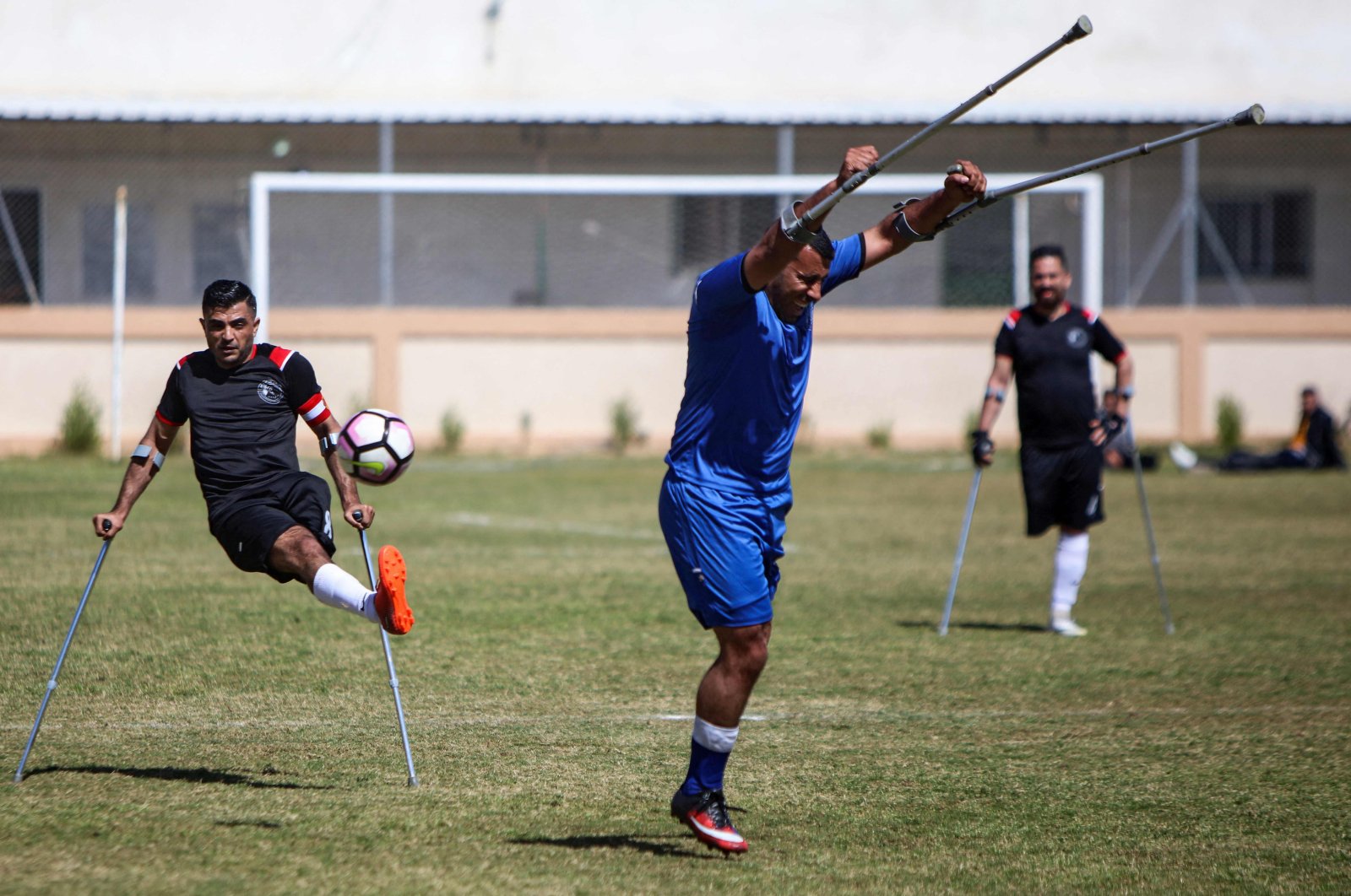 Palestinian players compete during the final of a local football championship for amputees between Al-Jazeera and Al-Abtal, organized by the International Committee of the Red Cross (ICRC), in Gaza City on March 18, 2021. (AFP Photo)