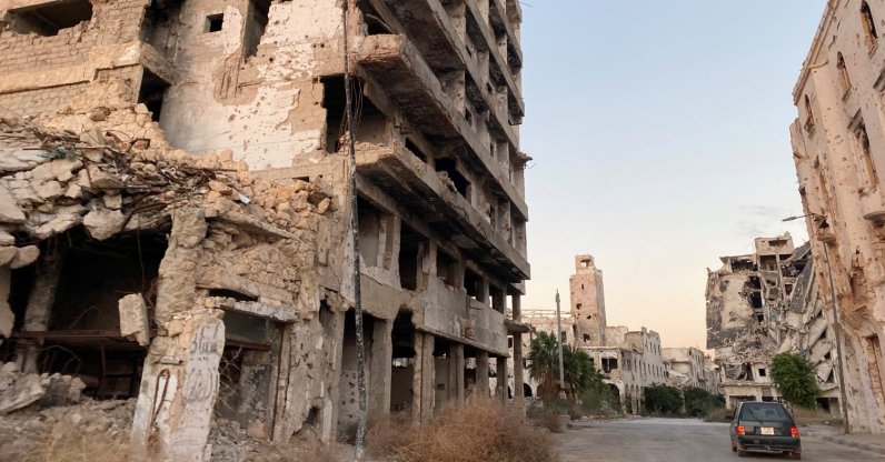 A car is seen between destroyed buildings in Benghazi, Libya Nov. 23, 2020. (Reuters File Photo)