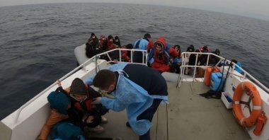 The Turkish coast guard rescues a group of migrants pushed back by Greek forces, in the Aegean Sea, Turkey, March 16, 2021. (IHA Photo)