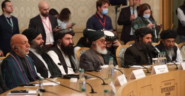 Former President Hamid Karzai (left) and Taliban co-founder Mullah Abdul Ghani Baradar (second right) attend an international peace conference in Moscow, Russia, March 18, 2021. (AP Photo)