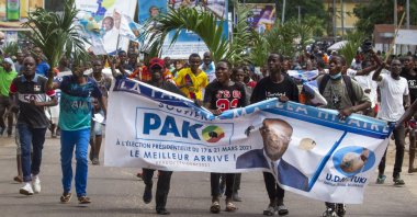 Supporters of opposition presidential candidate Guy Brice Parfait Kolelas cheer during their party's last rally of the presidential campaign in Brazzaville, Democratic Republic of Congo (DRC), March 19, 2021. (AP Photo)