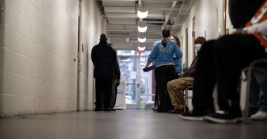 Nurses and members of the community wait to enter the area where Johnson & Johnson COVID-19 vaccinations are being administered at Wayside Christian Mission, Louisville, Kentucky, U.S., March 15, 2021. (Getty Images/AFP Photo)