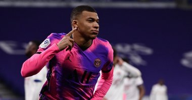 Paris Saint-Germain's French forward Kylian Mbappe celebrates a goal against Lyon (OL) at the Groupama Stadium in Decines-Charpieu, near Lyon, France, March 21, 2021. (AFP Photo)