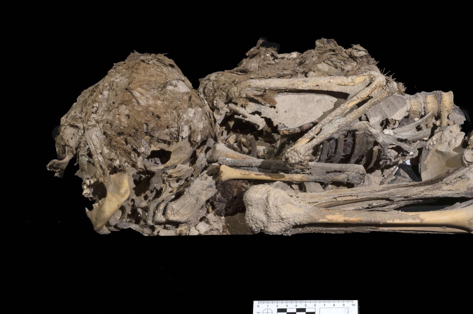 A handout picture provided by the Israeli Antiquities Authority on March 16, 2021, shows a picture taken on Nov. 21, 2019, of a 6,000-year-old mummified skeleton of a child excavated from a cave in the Judean Desert. (AFP Photo / Israel Antiquities Authority)