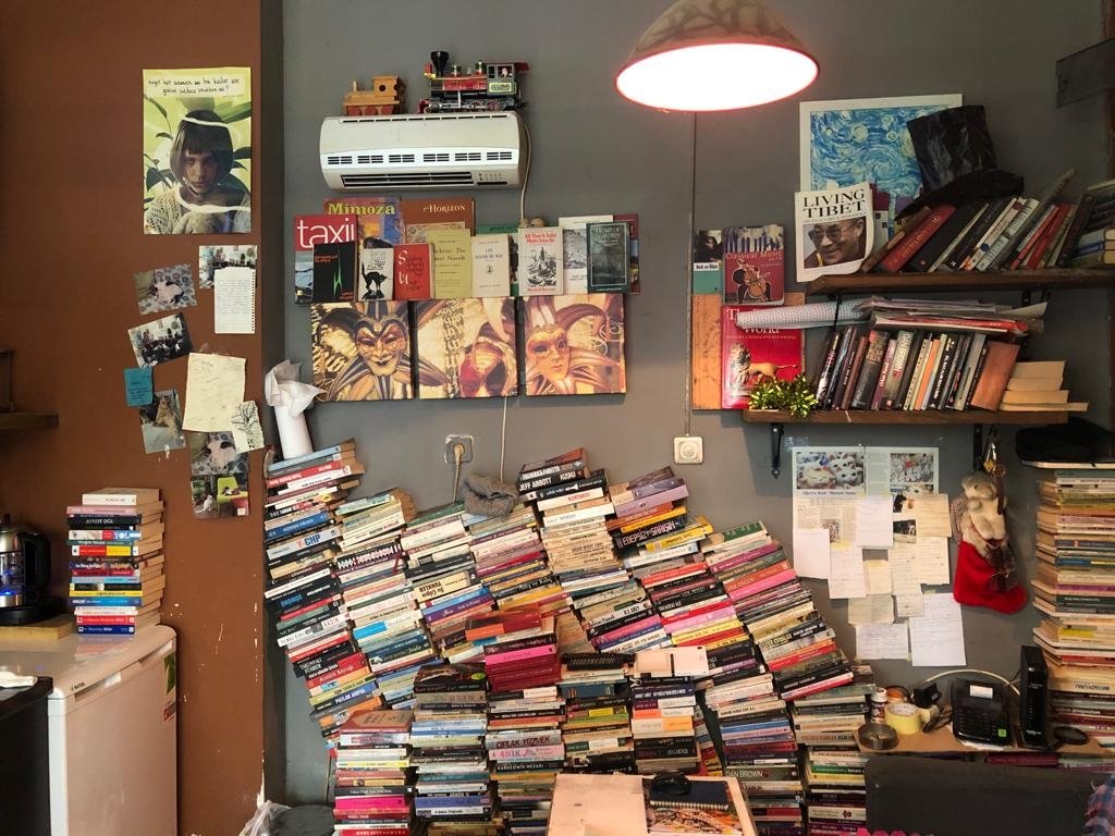 Photos of the bookstore's cats, artsy knickknacks and collector items are scattered across this sahaf in Ankara, Turkey. (Photo by Matt Hanson)