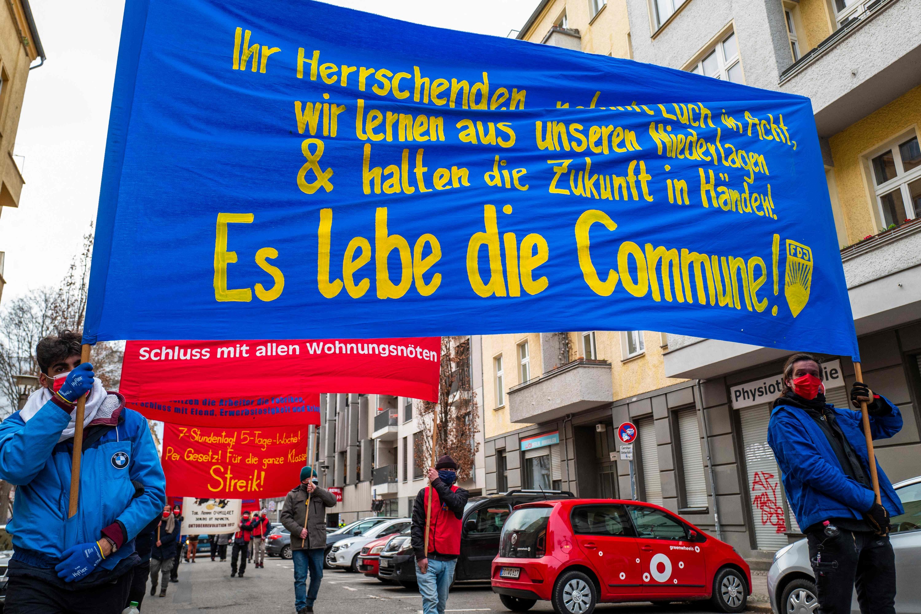 Protesters display a banner reading: The (Paris) Commune lives! during a demonstration by various leftist organizations to commemorate the 150th anniversary of the Paris Commune uprising, in Berlin, Germany, March 20, 2021. (AFP Photo)