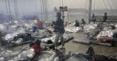Detainees in a Customs and Border Protection (CBP) temporary overflow facility in Donna, Texas, U.S., March 20, 2021. (Photo provided by the Office of Rep. Henry Cuellar, D-Texas, via AP)