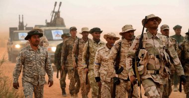Members of Libya's Petroleum Facilities Guard take part in a defense exercise near the town of Bir al-Ghanam, about 100 kilometers (62.14 miles) southwest of Libya's capital Tripoli, Libya, March 22, 2021. (Photo by Mahmud Turkia via AFP)