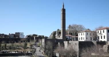 People stroll around the historical city walls in Saraykapı district in the southeastern city of Diyarbakır, Turkey, Jan. 22, 2020. (Reuters Photo)