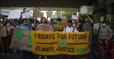 Student activists carry posters and shout slogans as they participate in a protest march against climate change in New Delhi, India, March 19, 2021. (AP Photo)