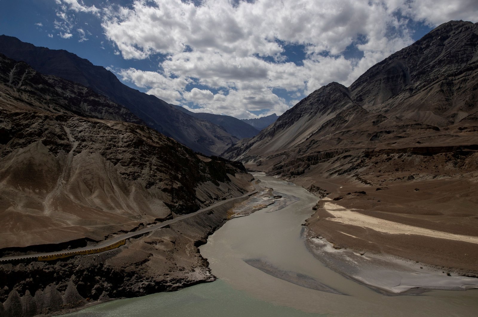 A highway being built by the Border Roads Organisation (BRO) passes by the confluence of the Indus and Zanskhar rivers in the Ladakh region, India, Sept. 17, 2020. (Reuters)