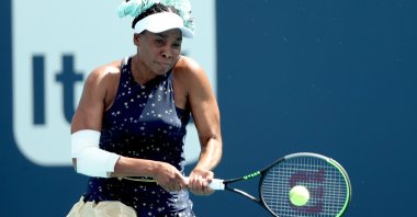 Venus Williams returns a shot to Zarina Diyas of Kazakhstan during the Miami Open at Hard Rock Stadium, Miami Gardens, Florida, U.S., March 23, 2021.