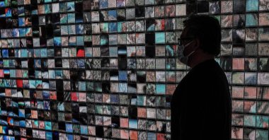 A man visits the art installation "Machine Memories: Space" by Refik Anadol in his exhibition at the Pilevneli Art Gallery in Istanbul, Turkey, March 18, 2021. (AA Photo)