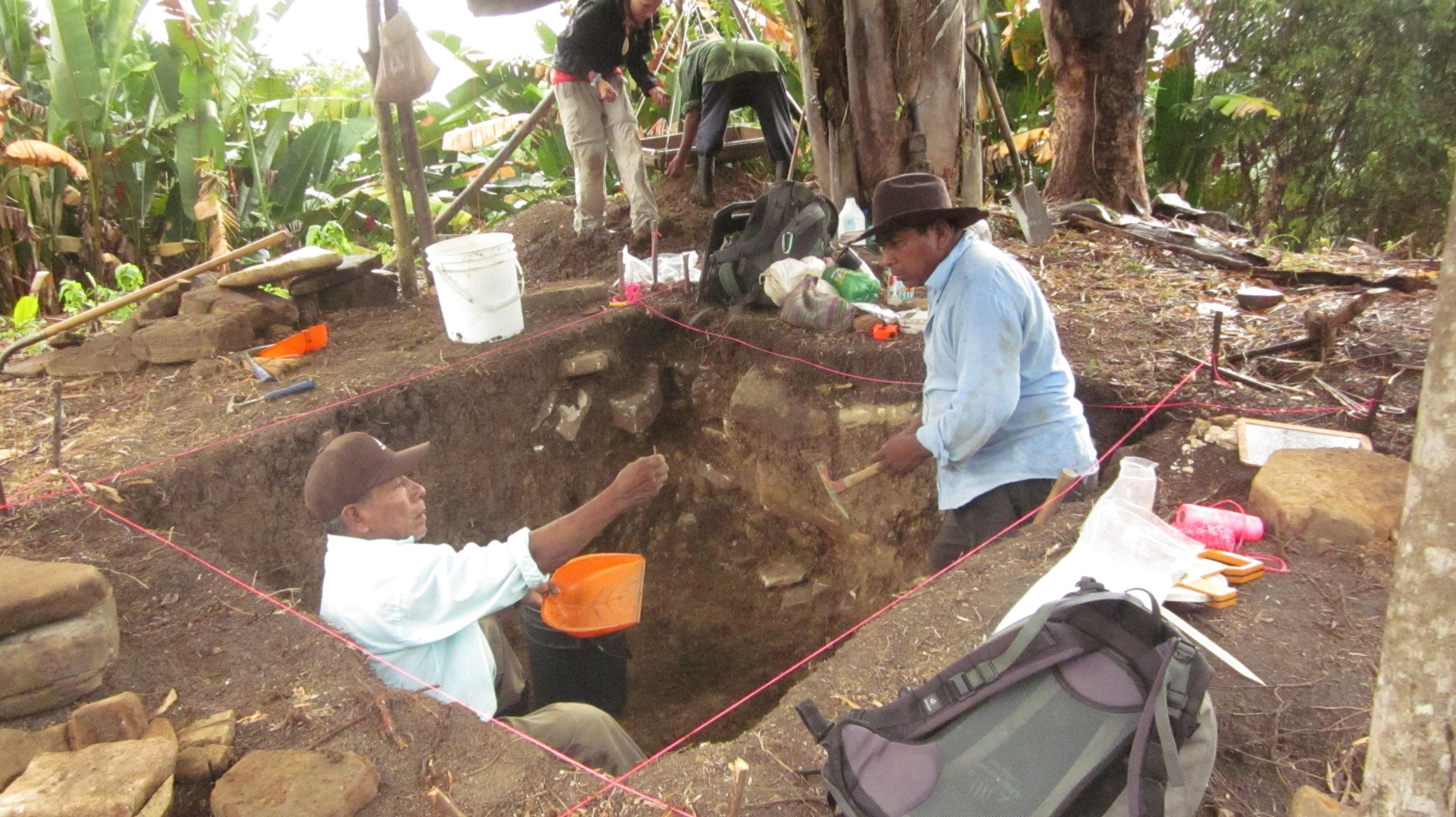 Members of the local community working with a team of archaeologists share finds during excavations at the remains of a house at the ancient Maya site of Uxbenka, Belize in April 2012. Picture taken in April 2012. (Handout via REUTERS)