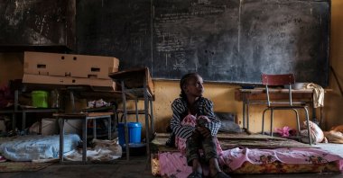 A displaced girl from Western Tigray sits on a mattress in a classroom at the school where she is sheltering in Tigray's capital Mekele, Ethiopia, Feb. 24, 2021. (AFP Photo)