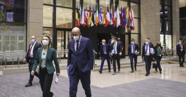 European Commission President Ursula von der Leyen (L) and European Council President Charles Michel arrive for an online joint news conference at the end of a European Union summit at the European Council building in Brussels, Belgium, March 25, 2021. (AP)