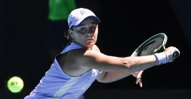 Ash Barty hits a backhand return during a quarterfinal match against Karolina Muchova at the Australian Open tennis championship in Melbourne, Australia, Feb. 17, 2021. (AP Photo)