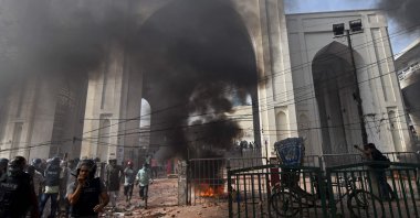 Activists set a motorcycle on fire during a clash with the police as they protest against the visit of Indian Prime Minister Narendra Modi in Dhaka, Bangladesh, March 26, 2021. (AFP Photo)