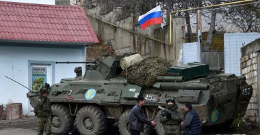 Men interact with Russian peacekeepers in the town of Lachin, Nagorno-Karabakh region, Azerbaijan, Nov. 30, 2020. (AFP Photo)