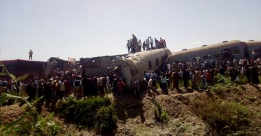 People inspect the damage after two trains have collided near the city of Sohag, Egypt, March 26, 2021. (Reuters Photo)
