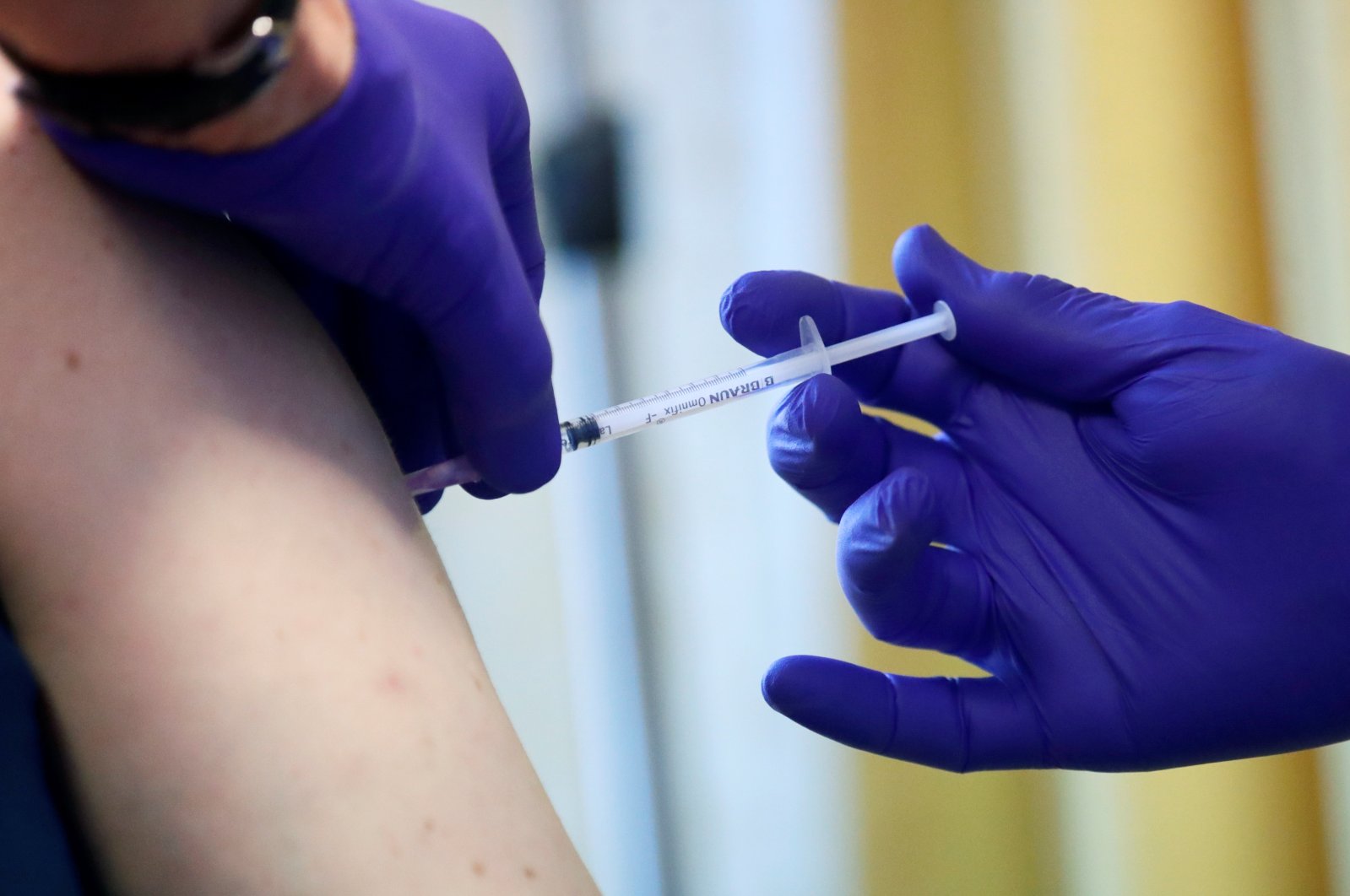 A patient receives a COVID-19 vaccine dose at a doctor's practice, Berlin, Germany, March 11, 2021. (Reuters Photo)