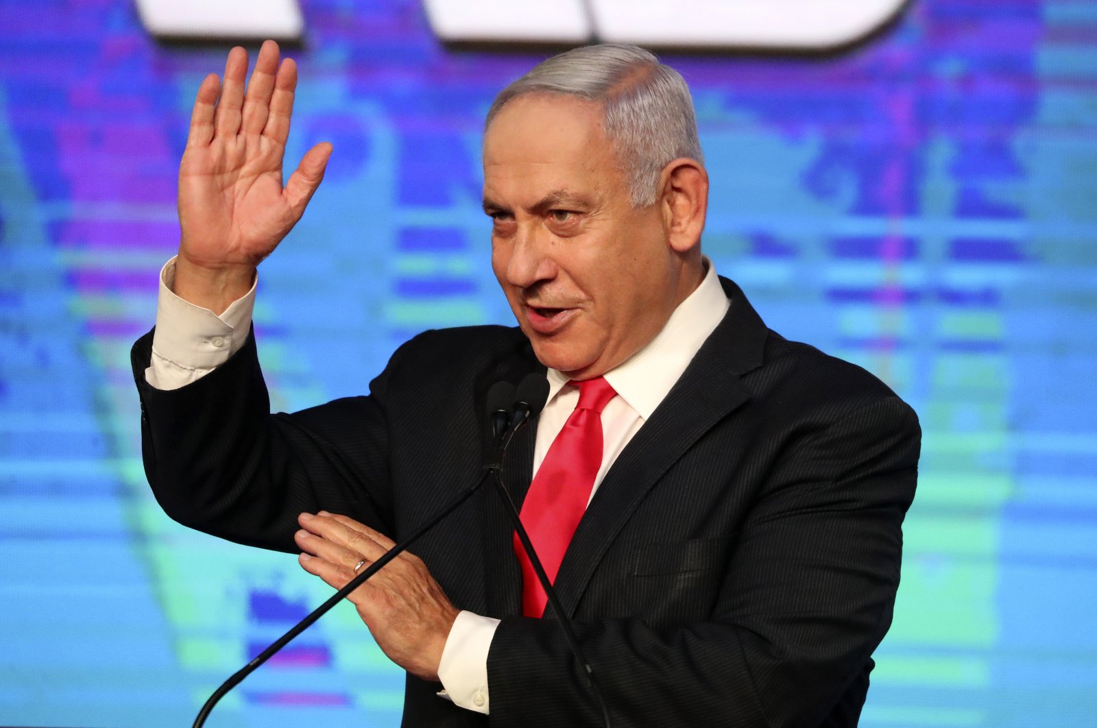 Israeli Prime Minister Benjamin Netanyahu addresses his supporters after the first exit poll results for the Israeli parliamentary elections at his Likud party's headquarters in Jerusalem, Israel, March 24, 2021. (AP Photo)