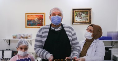 Children with autism make food that is sold to consumers by the Autism Foundation in the capital Ankara, Turkey, March 6, 2021. (AA Photo)