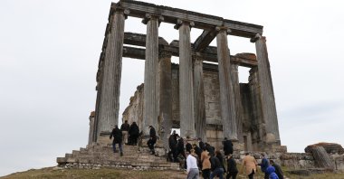 A group of people visit the ancient Temple of Zeus in the 5,000-year-old city of Aizanoi, Kütahya, western Turkey, March 14, 2021. (AA Photo)