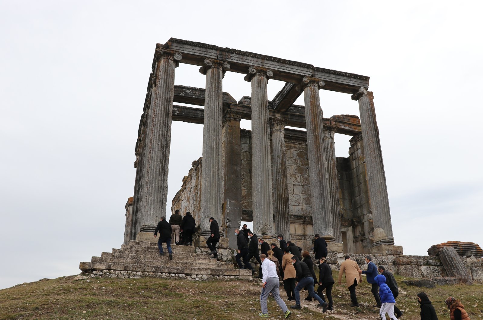 A group of people visit the ancient Temple of Zeus in the 5,000-year-old city of Aizanoi, Kütahya, western Turkey, March 14, 2021. (AA Photo)