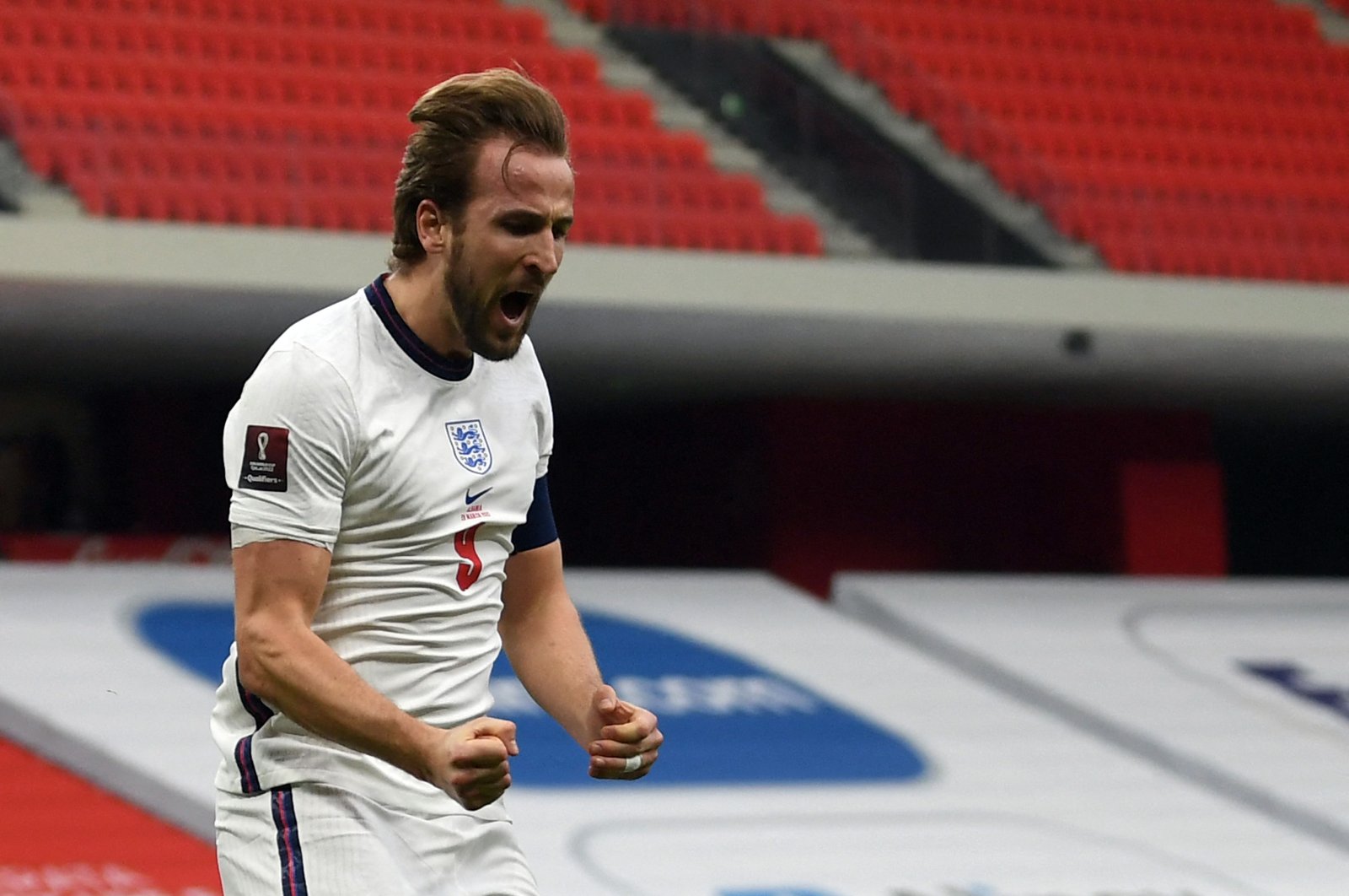 England's forward Harry Kane celebrates after scoring a goal during the FIFA World Cup Qatar 2022 qualification Group I football match between Albania and England at the Arena Kombetare, in Tirana, Albania, March 28, 2021. (AFP Photo)