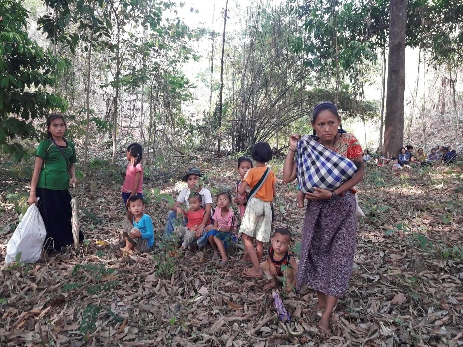 In this picture obtained from social media, villagers are seen fleeing the Karen State at an unidentified location, March 28, 2021. (Karen Teacher Working Group via Reuters)