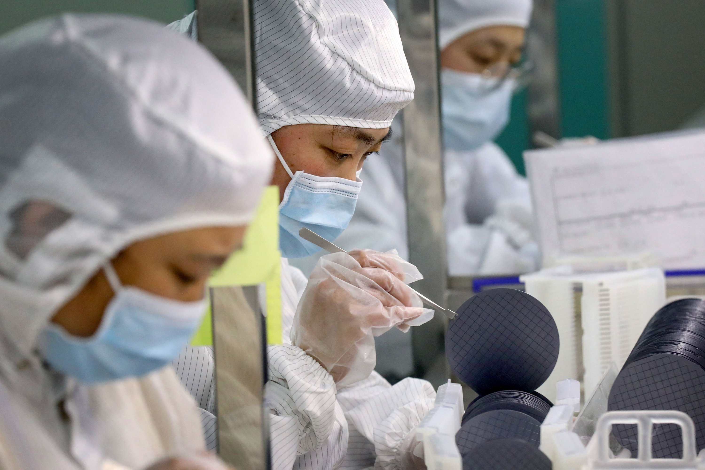 Employees make chips at a factory of Jiejie Semiconductor Company in Nantong, Jiangsu province, China, March 17, 2021. (AFP Photo)