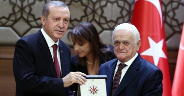 Mehmet Genç (R) receives his Presidential Culture and Arts Grand Prize from President Recep Tayyip Erdoğan at the Presidential Complex in the capital Ankara, Turkey, Dec. 9, 2015. (AA Photo)
