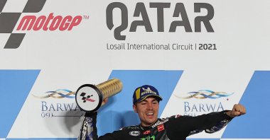 Monster Energy Yamaha MotoGP's Spanish rider Maverick Vinales celebrates winning the Qatar Grand Prix at the Losail International Circuit, Lusail, Qatar, March 28, 2021. (AFP Photo)