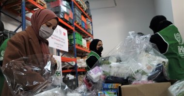 Turkish women who volunteer for the IHH prepare hygiene product packages for Syrian refugees living in northwestern Syrian camps, Bursa, Turkey, March 29, 2021. (AA)