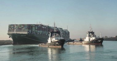 The Ever Given, a Panama-flagged cargo ship, is pulled by tugboats, in the Suez Canal, Egypt, March 29, 2021. (Suez Canal Authority via AP)