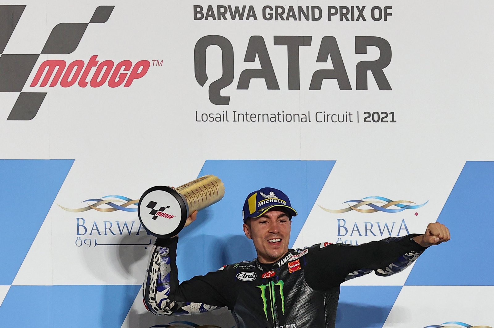 Monster Energy Yamaha MotoGP's Spanish rider Maverick Vinales celebrates winning the Qatar Grand Prix at the Losail International Circuit, Lusail, Qatar, March 28, 2021. (AFP Photo)