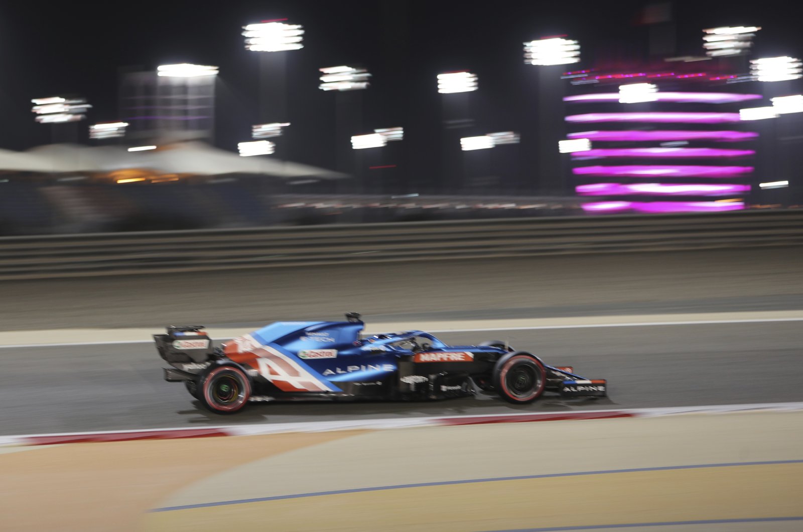 Alpine driver Fernando Alonso of Spain steers his car during the qualifying session for the Bahrain Formula One Grand Prix, at the Bahrain International Circuit in Sakhir, Bahrain, March 27, 2021. (AP Photo)