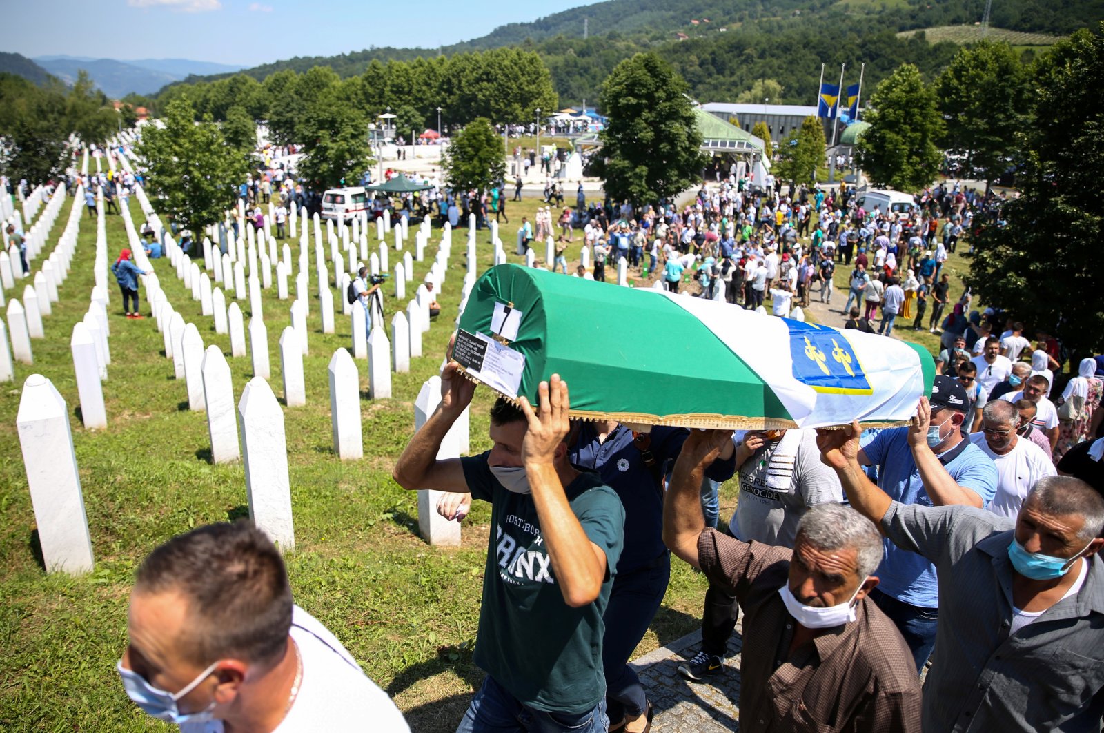 Men carry a coffin at a graveyard during a mass funeral in Potocari near Srebrenica, Bosnia and Herzegovina, July 11, 2020. (Reuters Photo)