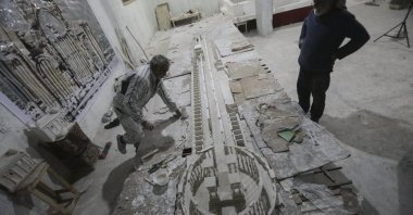 Ali Taha works on an enormous model of the ancient city of Palmyra in his workshop, al-Bab, Syria, March 29, 2021. (AA Photo)