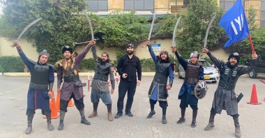 Celal Al (C) poses with the young Pakistani group shooting the "Pakistani Ertuğrul," in Karachi, Pakistan, March 30, 2021. (AA Photo) 