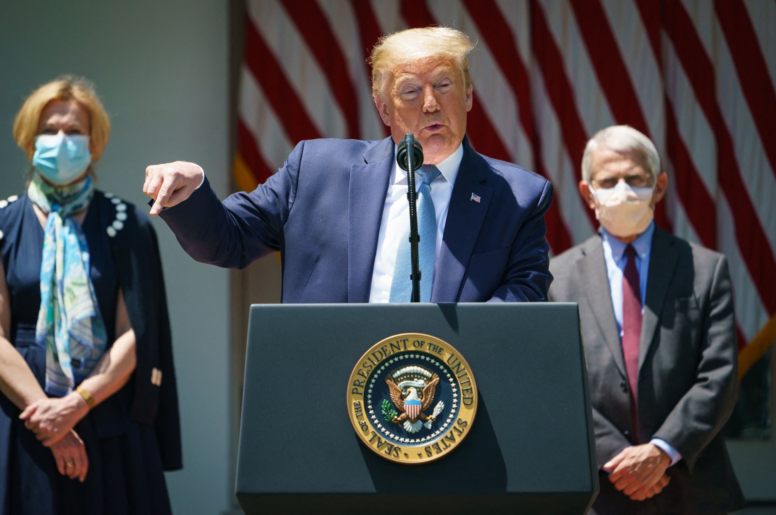 U.S. President Donald Trump speaks on vaccine development in the Rose Garden of the White House flanked by White House Coronavirus Task Force Deborah Birx and Director of the National Institute of Allergy and Infectious Diseases Anthony Fauci, Washington, D.C., U.S., May 15, 2020. (AFP Photo)